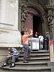 Обычно при входе в костел сидит человек, продающий туристам билеты на концерты классической музыки.