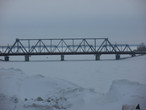Железнодорожный мост через реку Сызранку, а за ним Волга.