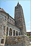 Здание церкви — в виде романской базилики с квадратной колокольней и высокой башней...
*