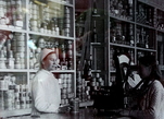 Магазин  на  улице Ленина.  Ю. Сахалин. 1952 г. Обратите внимание —   на   стеллажах одни банки. Даже картошка была сушеной. Все  резко  изменилось  в  лучшую  сторону  в   шестидесятых годах.