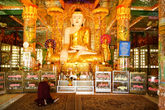 В храме при ней тоже очень праздничный Будда.