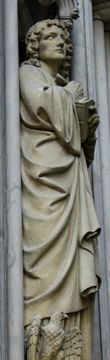 Церковь Св. Ламберта, западный портал, Св. Иоанн в образе Ф. Шиллера, у ног которого его символ — орел