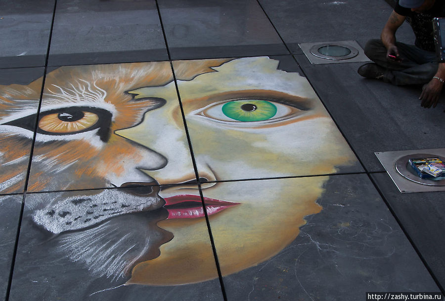Уличный художник у центра Помпиду Париж, Франция