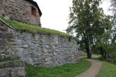 Крепость изначально была деревянной. Её  заложили новгородцы  на реке Вуоксе (в те времена Узерве) для защиты северо-западных рубежей от шведов. А через 50 лет постройки полностью погибли в сильнейшем пожаре (вот откуда берутся пожары эти).